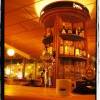 The main “column” - Round wooden bar cabinet Carmela JAzz & Wine Bar